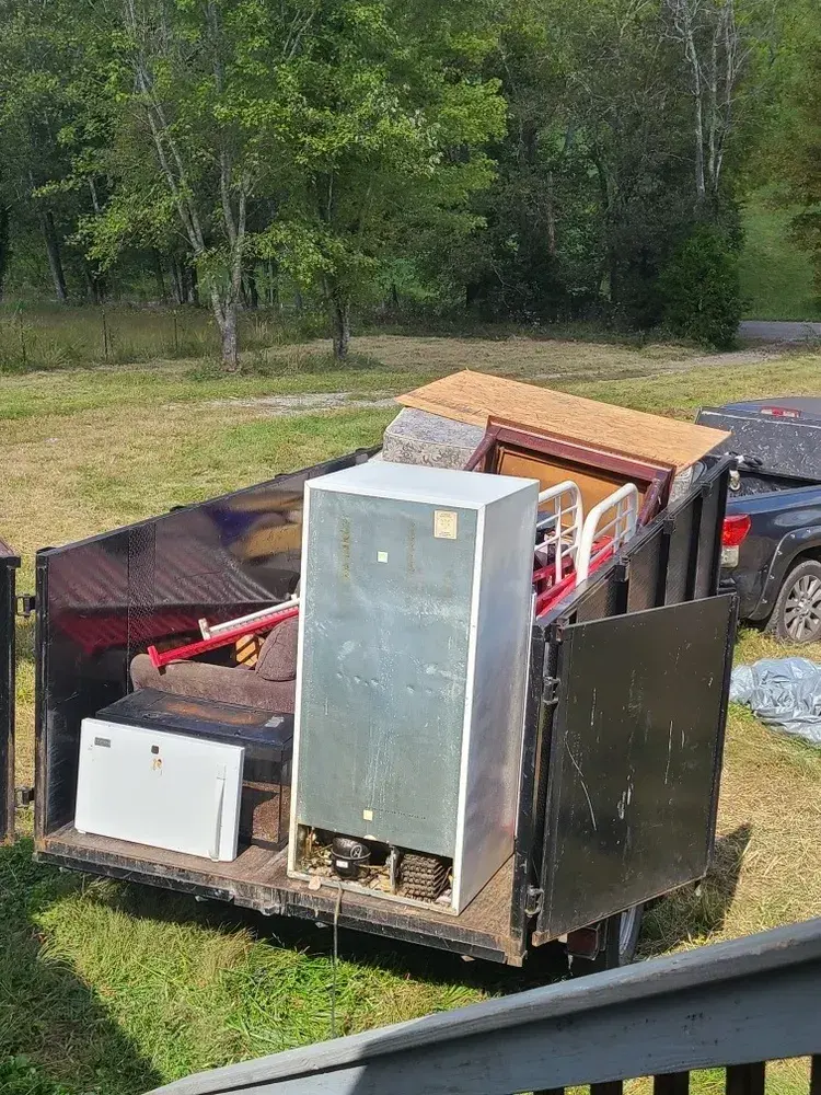 Refrigerator and appliances loaded on a trailer