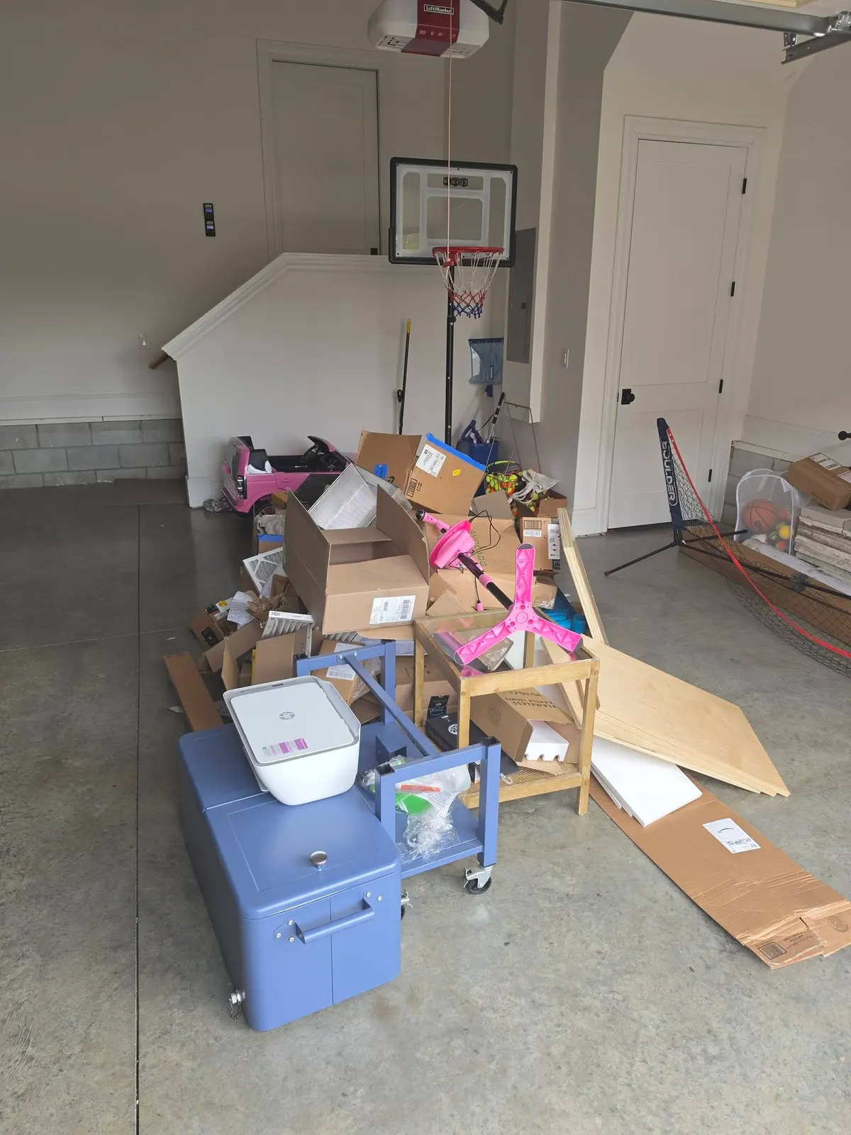 Garage full of clutter before cleanout